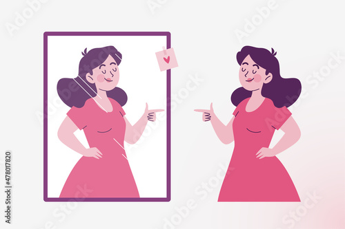 Confident woman looks at herself in the mirror