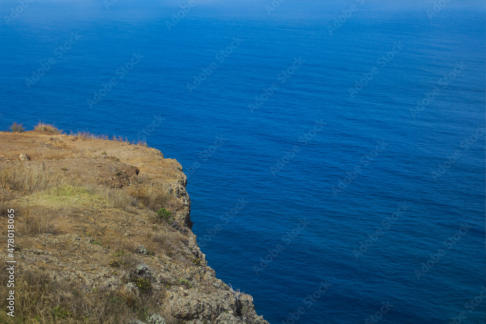 View of natural hill near the sea.
Mountain coast in Funchal, Madeira.
Ocean view of the coast of island