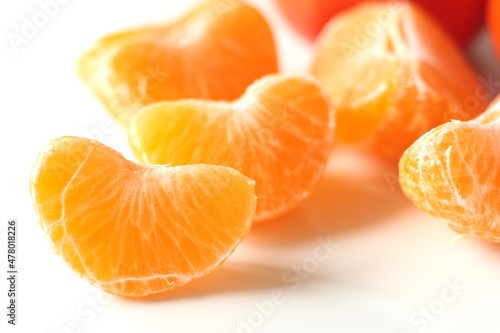 unpeeled slices of yellow mandarin