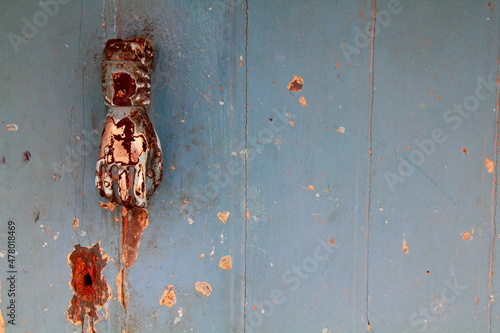 Grunge background : obsolete rusty door knocker