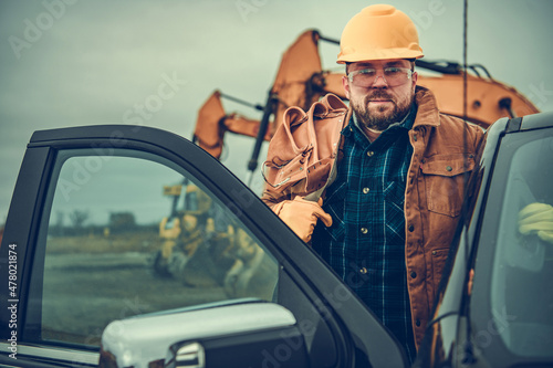 Fotografiet Construction Contractor Worker with Tool Belt on His Shoulder