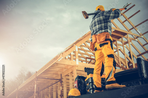Murais de parede Strong Construction Worker with a Large Hammer Ready For Tough Job