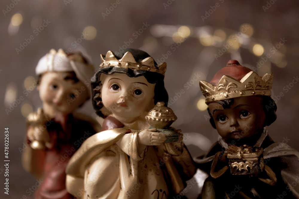 The Three Kings carrying their gifts adoring the Child Jesus. Close up. Epiphany day concept. The Three Kings carrying their gifts adoring the Child Jesus. Close up. Epiphany day concept.