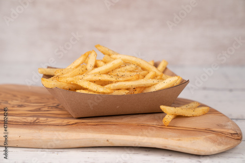 French fries in cardboard container 