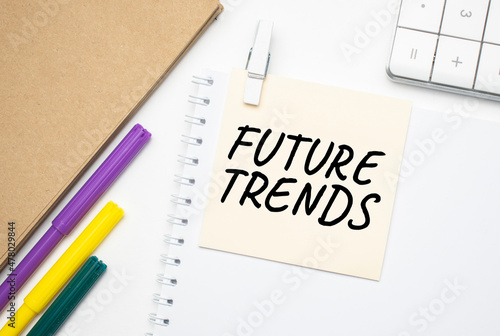 Future trends Notebook on laptop keyboard, on light background