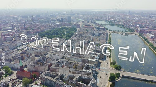 Inscription on video. Copenhagen, Denmark. Central historical part of the city, city roofs and Copenhagen lakes. Aerial view. Neon white effect text, Aerial View photo