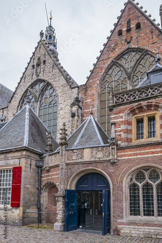 Amsterdam Old Church (Oude Kerk), oldest parish church, founded in 1213. Oude Kerk stands in Amsterdam De Wallen district on Old Church's Square (Oudekerksplein). Amsterdam, The Netherlands.