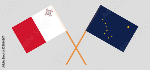 Crossed flags of Malta and the State of Alaska. Official colors. Correct proportion