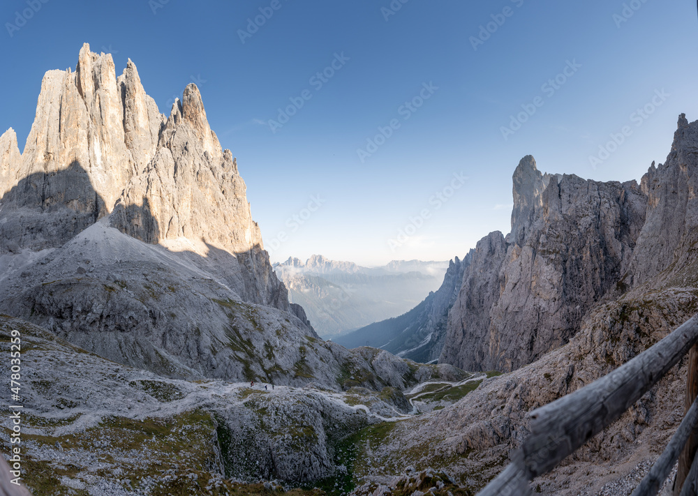 hiking trail in the pale di san martino on a sunny day in the dolomites