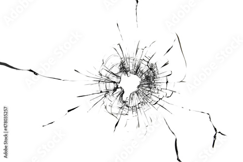 Holes from balls in glass on a white background. The texture of cracked broken glass.