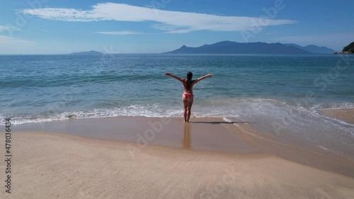 Brazilian woman in bikini on a deserted beach in Ubatuba, São Paulo, Brazil. Playing in the sea water
Atlantic forest, yellow sand and clear sea water. Figueira beach paradise.
