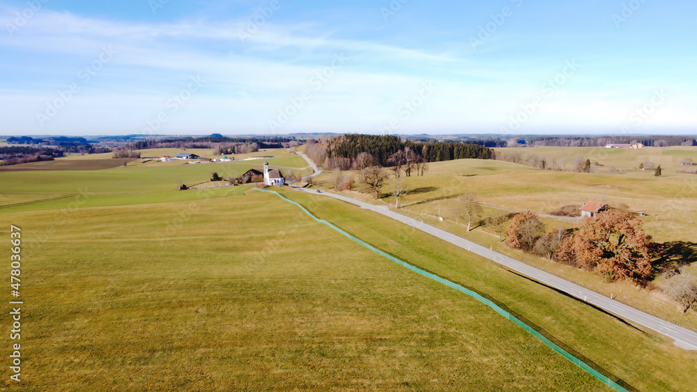 View from above over the Ammergau Alps near Wessobrunn on a sunny day with blue sky