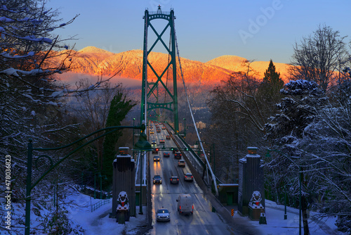 Car traffic on the bridge on a snowy winter evening