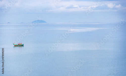 panorama one boat alone in the blue sea. Concept of alone in natural
