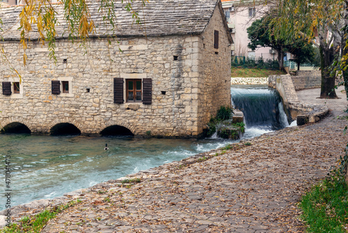 Traditional 17th-century watermill called Gaspina mlinica on the river Jadro in Solin, Croatia photo