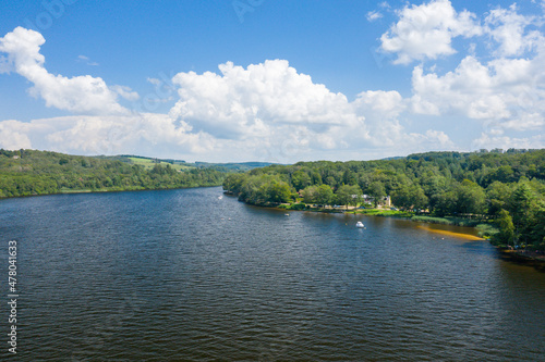 The Lac des Settons and its campsites in the forest in Europe, France, Burgundy, Nievre, Morvan, in summer, on a sunny day.