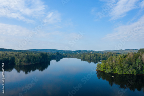 Fototapeta Naklejka Na Ścianę i Meble -  The islands of Lac des Settons and its green forests in Europe, France, Burgundy, Nievre, Morvan, in summer, on a sunny day.