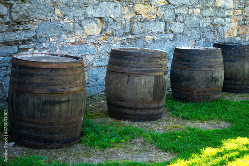 Wine and cognac oak barrels with metal hoops 