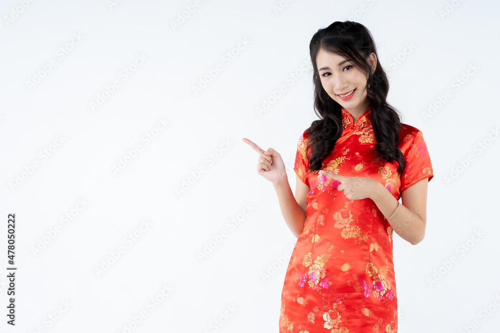 beauty woman wear cheongsam and smile to you in chinese new year beauty woman wear cheongsam and smile to you in chinese new year