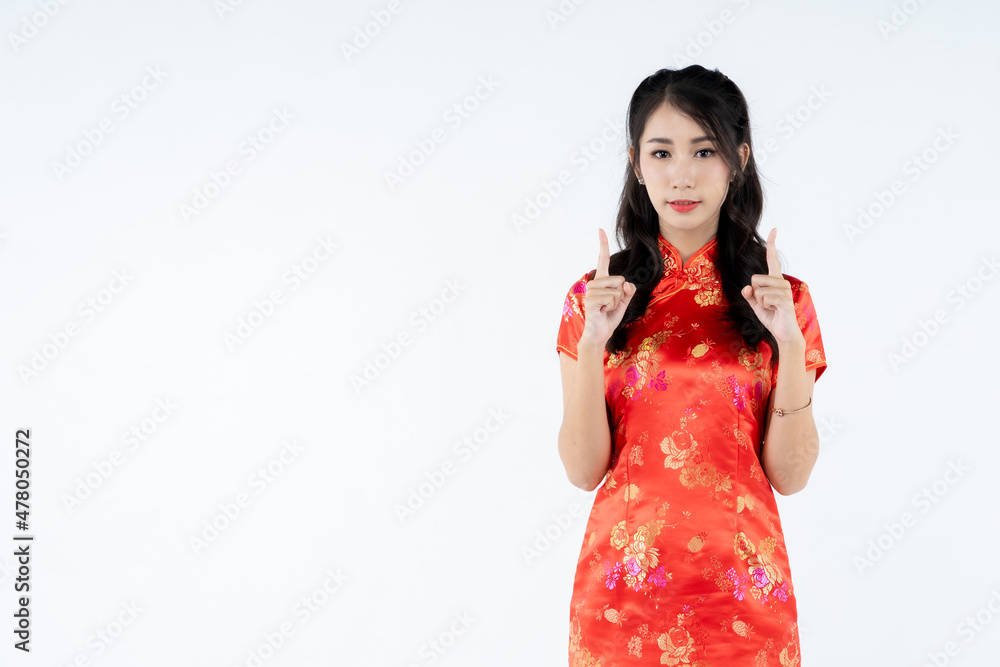 beauty woman wear cheongsam and smile to you in chinese new year beauty woman wear cheongsam and smile to you in chinese new year