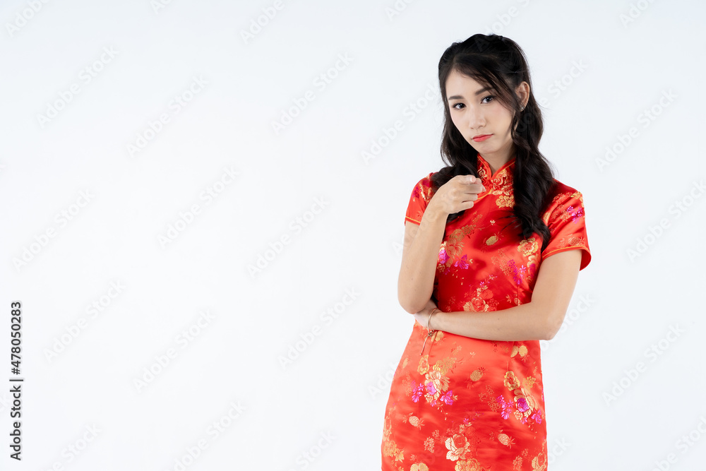 beauty woman wear cheongsam and smile to you in chinese new year beauty woman wear cheongsam and smile to you in chinese new year