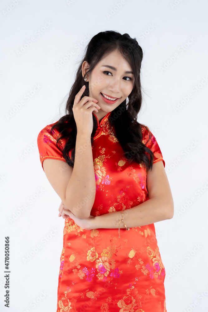 beauty woman wear cheongsam and smile to you in chinese new year beauty woman wear cheongsam and smile to you in chinese new year