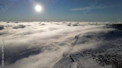 Wallpaper Mural Drone view above the clouds on mountain range ski road and wire in snow in winter day nature and tourism concept Stara Planina Old Mountain Balkan in Serbia  Torontodigital.ca