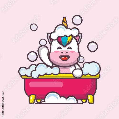 Cute unicorn taking bubble bath in bathtub. Cute cartoon animal illustration.