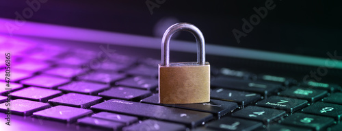 Cybersecurity concept, padlock on laptop computer keyboard photo