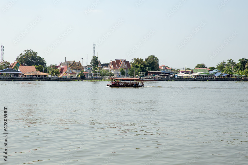 Tourists boat is moving cross the Chao Phraya river, Thailand