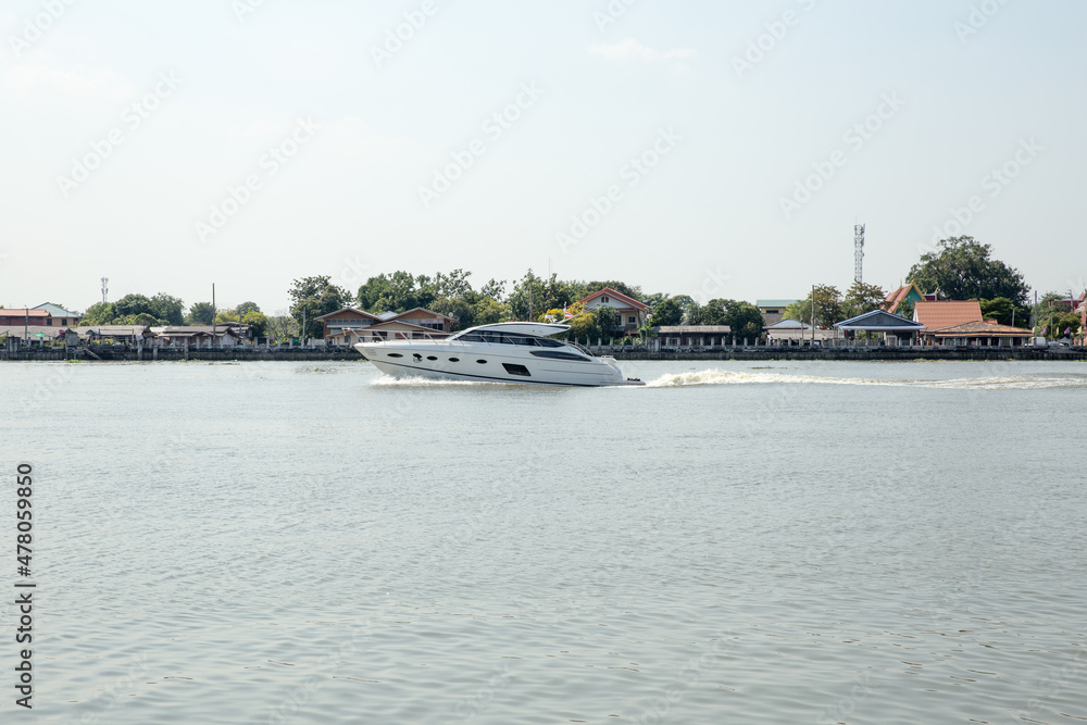 The White Speed boat Ship is moving in the Chao Phraya river, Thailand The White Speed boat Ship is moving in the Chao Phraya river, Thailand