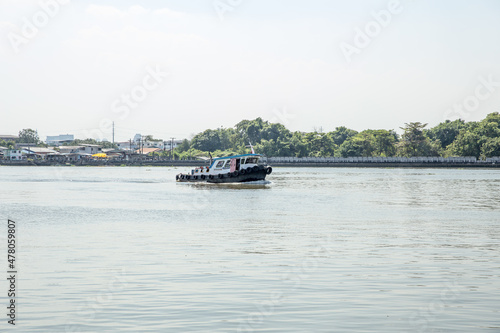 The tugboat is moving in the Chao Phraya river, Thailand