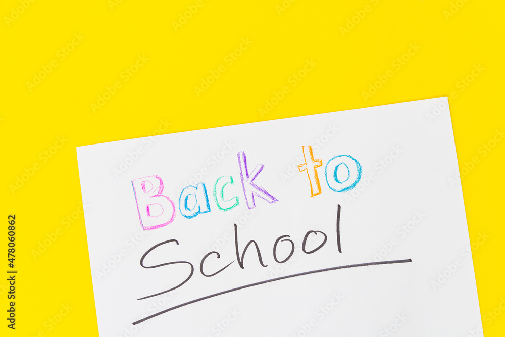 Colorful stationary school supplies with crayon text Colorful stationary school supplies with crayon text