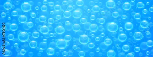 Seamless pattern air bubbles on blue water surface. Abstract background with transparent soap or shampoo balloons, underwater fizzing, texture or wallpaper design, Realistic 3d vector illustration