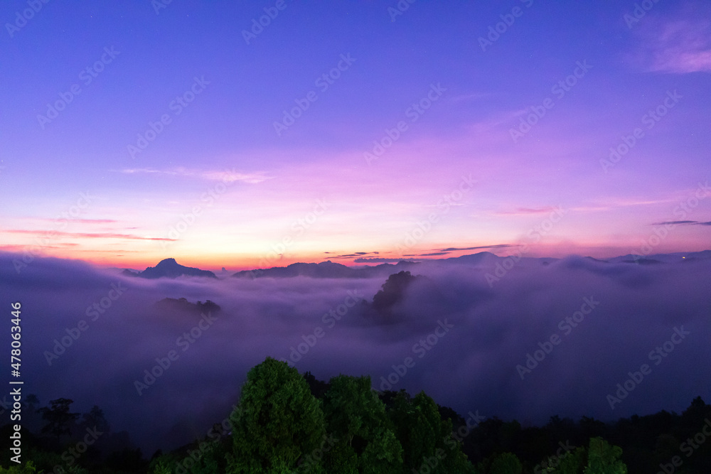 The beautiful early morning sky with twilight and waves of fog of Baan Ja Bo village viewpoint Pang Mapha, Mae Hong Son, Northern Thailand. 