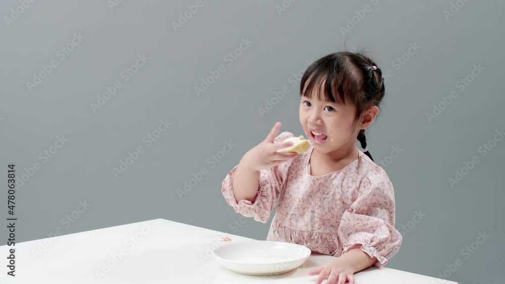 Child eating sweet and smearing all the face. Child eating sweet and smearing all the face.
