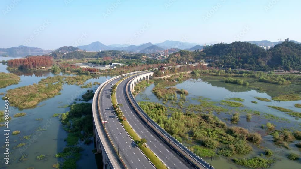 aerial view of arch bridge over tiaoxi river