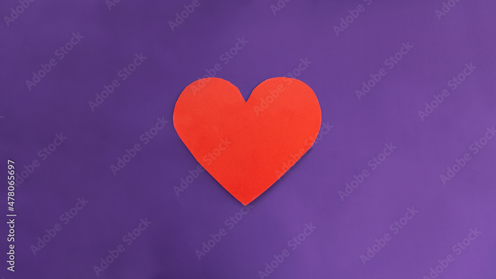 card in the form of a red heart and flowers in a white envelope on a textured blue background. Selective focus. Message and congratulations on Valentine's Day. Valentine's Day greeting cards.
