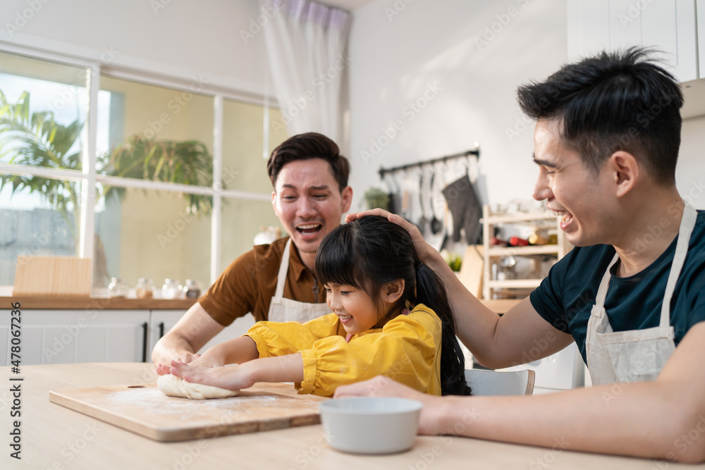 Asian attractive LGBTQ gay family teach girl kid making yeast dough. 