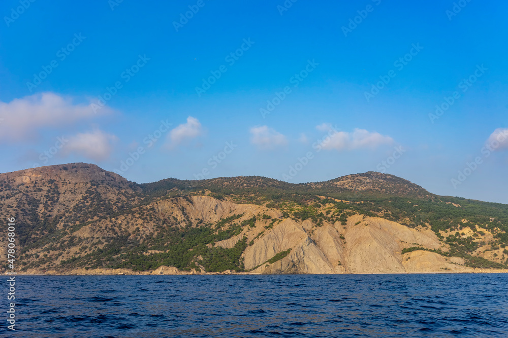 Seascape with a view of the hilly coastline