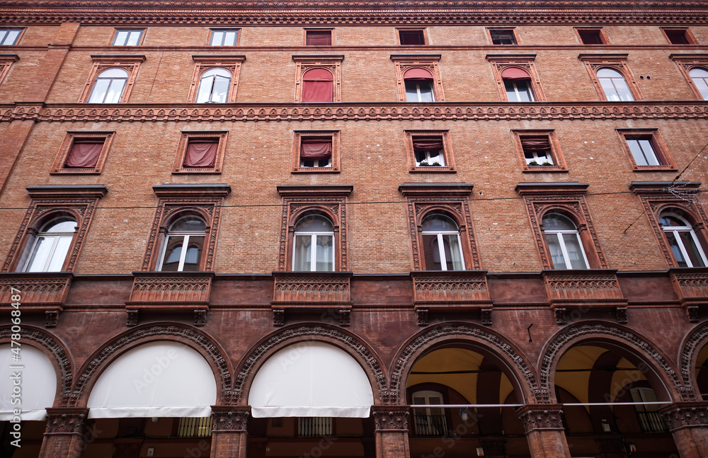 Old Renaissance style palace facade in Bologna historic center. Italy.