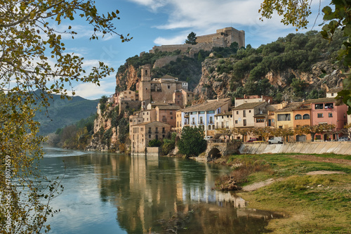 Miravet village and its Templar castle on top of the hill on the banks of the Ebro river, Tarragona, Spain photo