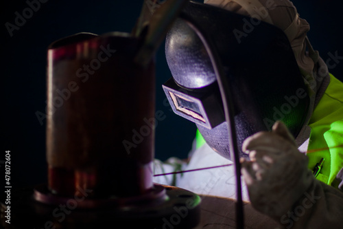 Man works on metal welding steel using electric welding machine to weld. High quality photo