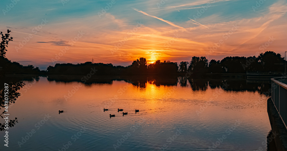 Beautiful sunset view with reflections near Plattling, Isar, Bavaria, Germany