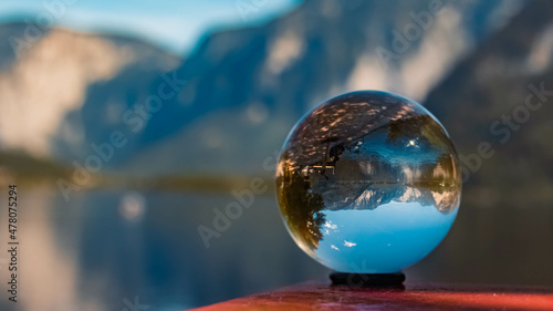 Crystal ball alpine summer landscape shot with reflections at the famous Hallstaetter See lake near Hallstatt, Upper Austria, Austria © Martin Erdniss
