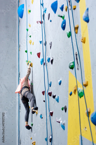 climbing wall background. person climbing on wall