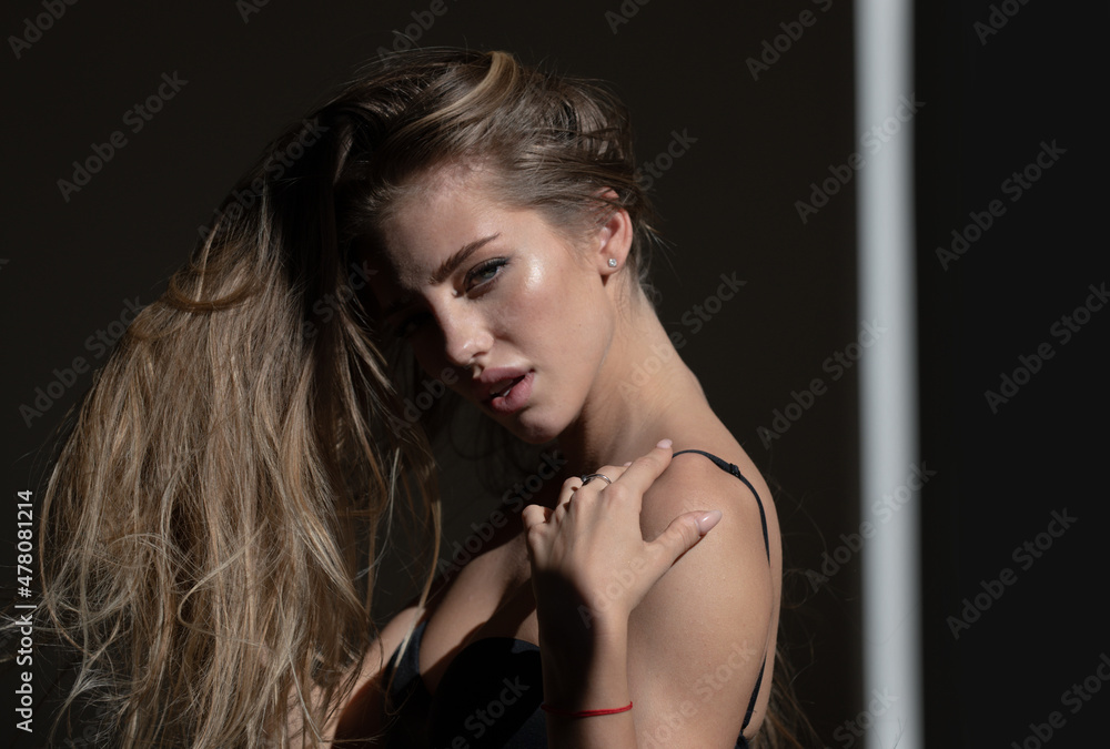 Sexy gorgeous woman with shadows on beautiful face on black studio. Fashion model, black vogue of elegant girl. High fashion look. Sexy gorgeous woman with shadows on beautiful face on black studio. Fashion model, black vogue of elegant girl. High fashion look.