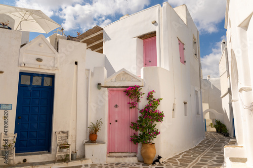 Marpissa, Greece - July 20, 2021: Colorful doors in white buildings in Marpissa