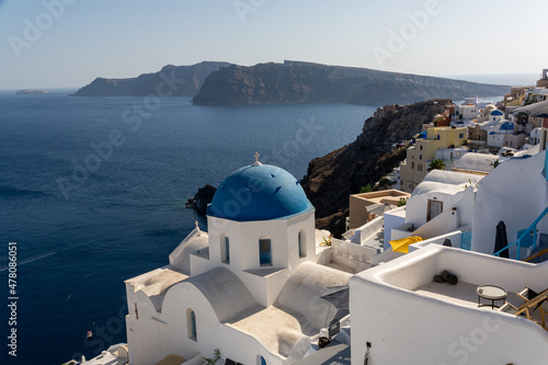 Oia, Greece - July 30, 2021: View of the church St. Anastasi and St. Spirydon in Oia