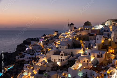 The windmills of Oia in Santorini, Greece, during dusk